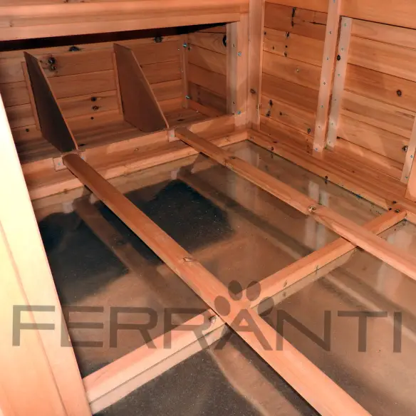 Intérieur de poulailler en bois avec tiroir à déjections